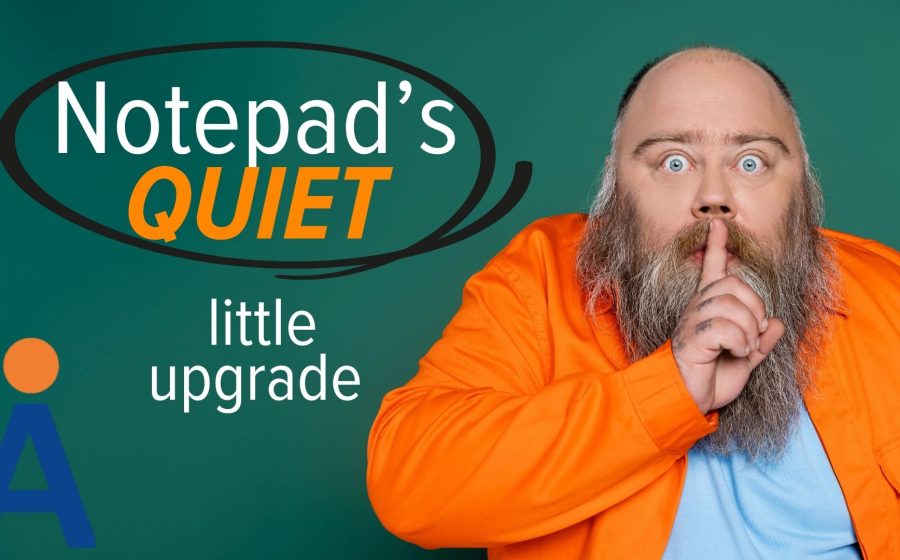 A man with a beard wearing an orange jacket holds a finger to his lips, signaling quiet. The text reads: Notepad’s QUIET little upgrade—hinting at changes to Windows Notepad—with a large A logo in the bottom left corner.