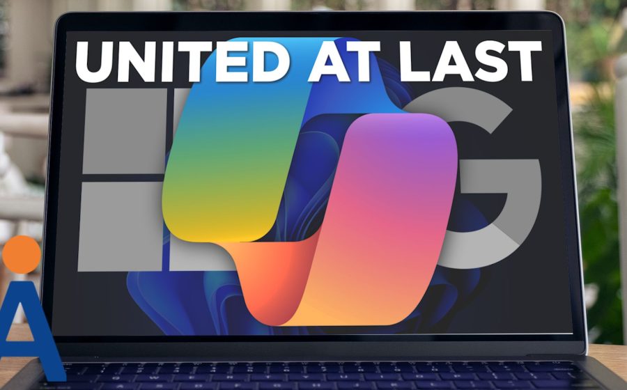 A laptop screen displays the text UNITED AT LAST above a colorful Microsoft Office logo, with faded Windows and Mac logos in the background—hinting at a forthcoming Windows update that lets Copilot work across Microsoft and Google platforms. A dark blue keyboard is visible.