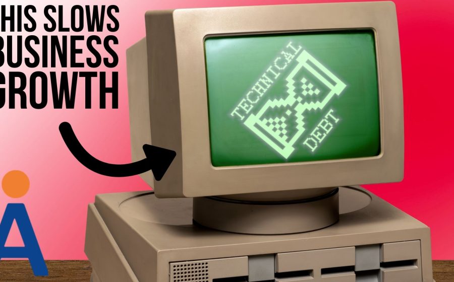 A vintage computer displays TECHNICAL DEBT with an hourglass symbol on its screen, highlighting how out-of-date hardware creates business risk and slows your business down. Text reads THIS SLOWS BUSINESS GROWTH, with a stylized A logo in the corner.